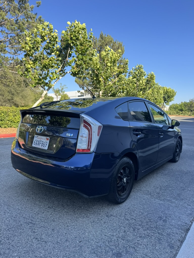 Blue 2012 Toyota Prius rear passenger-side three-quarter view
