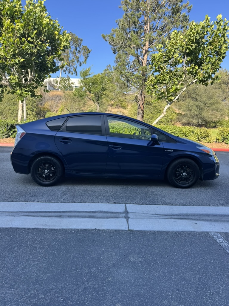 Blue 2012 Toyota Prius full passenger-side profile view