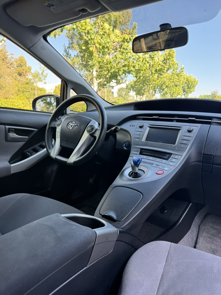 2012 Toyota Prius interior view of dashboard, steering wheel and center console