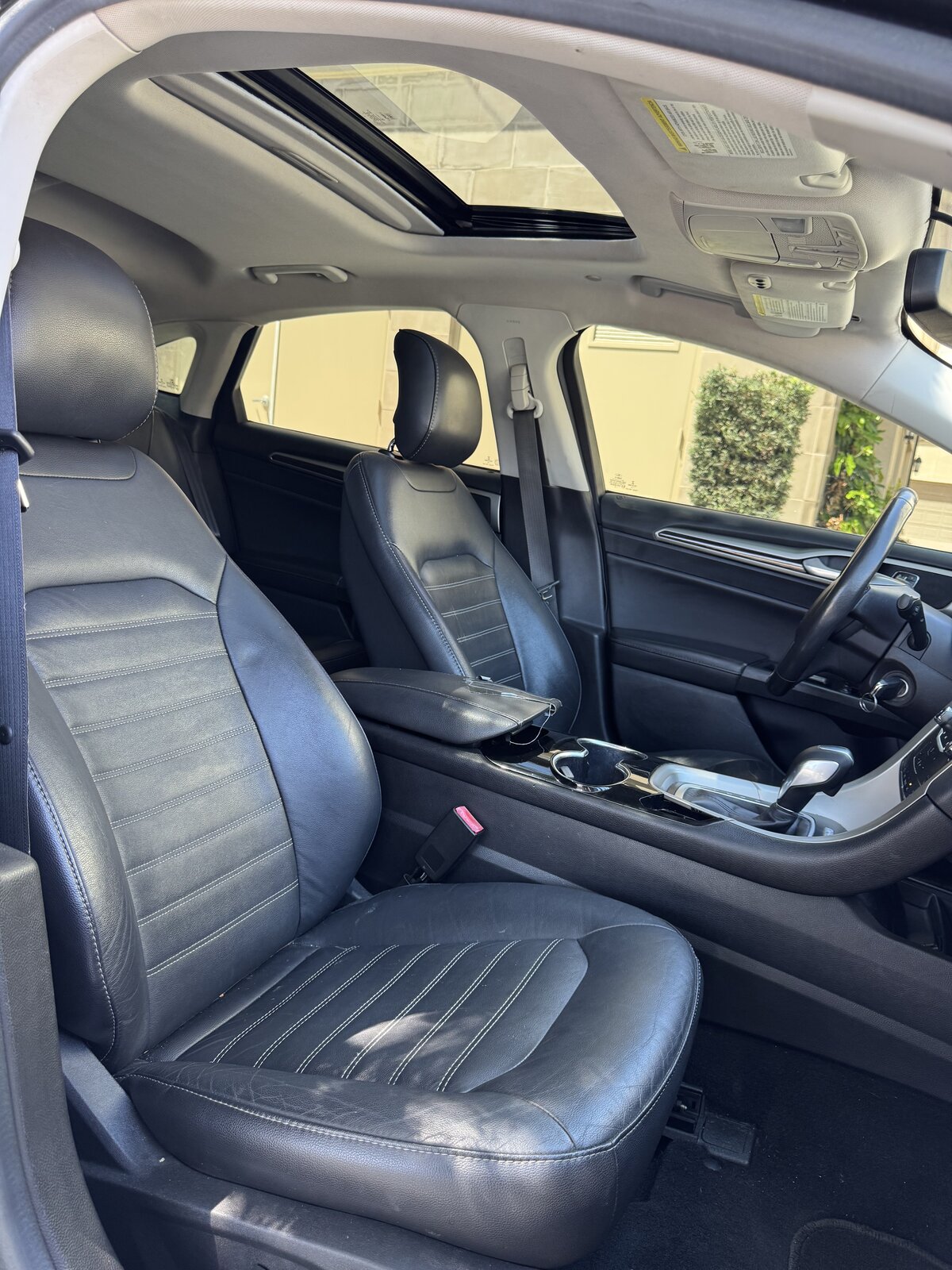 2014 Ford Fusion Hybrid front leather seats seen from the passenger side