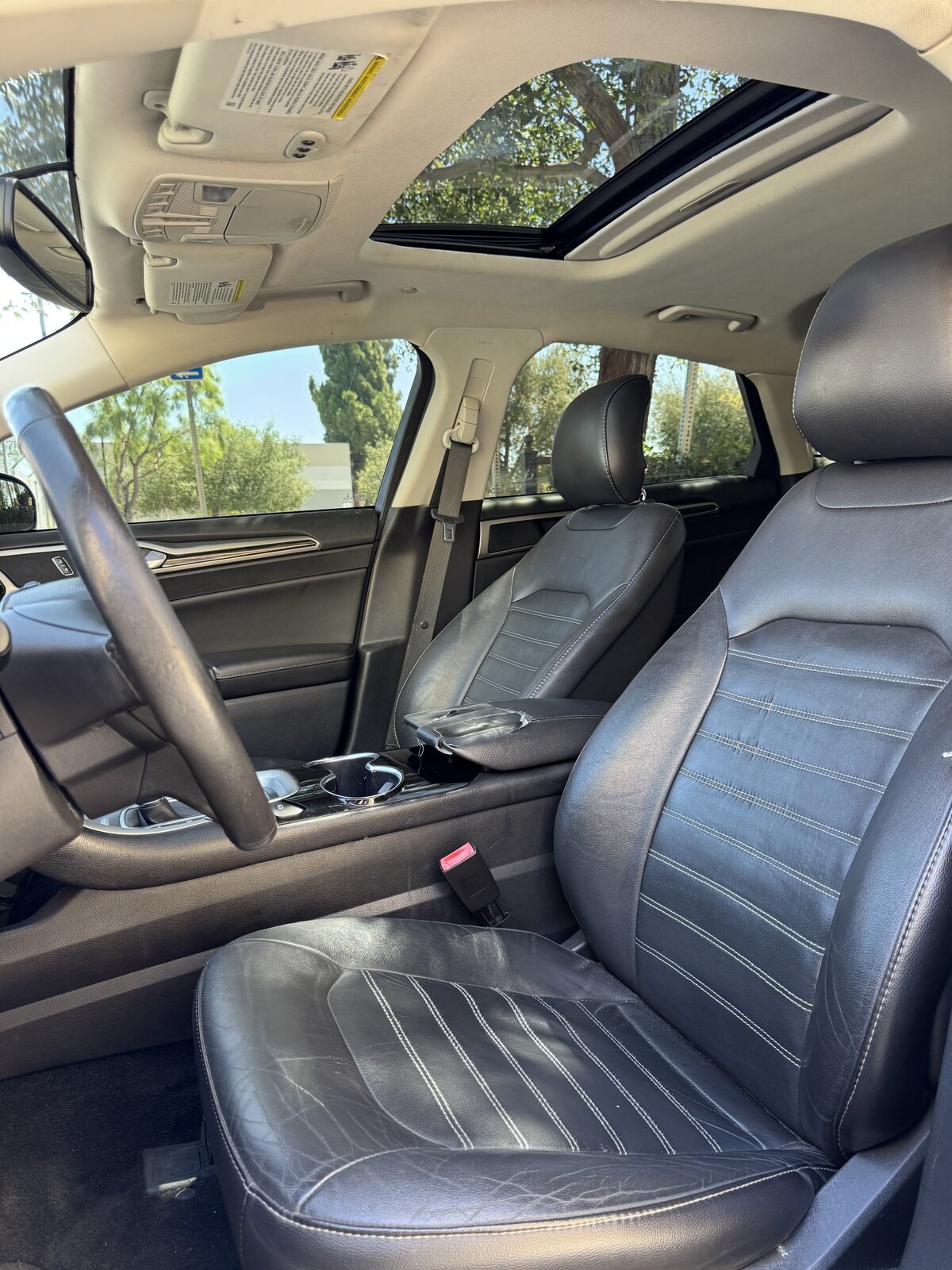 2014 Ford Fusion Hybrid front cabin with leather seats and moonroof
