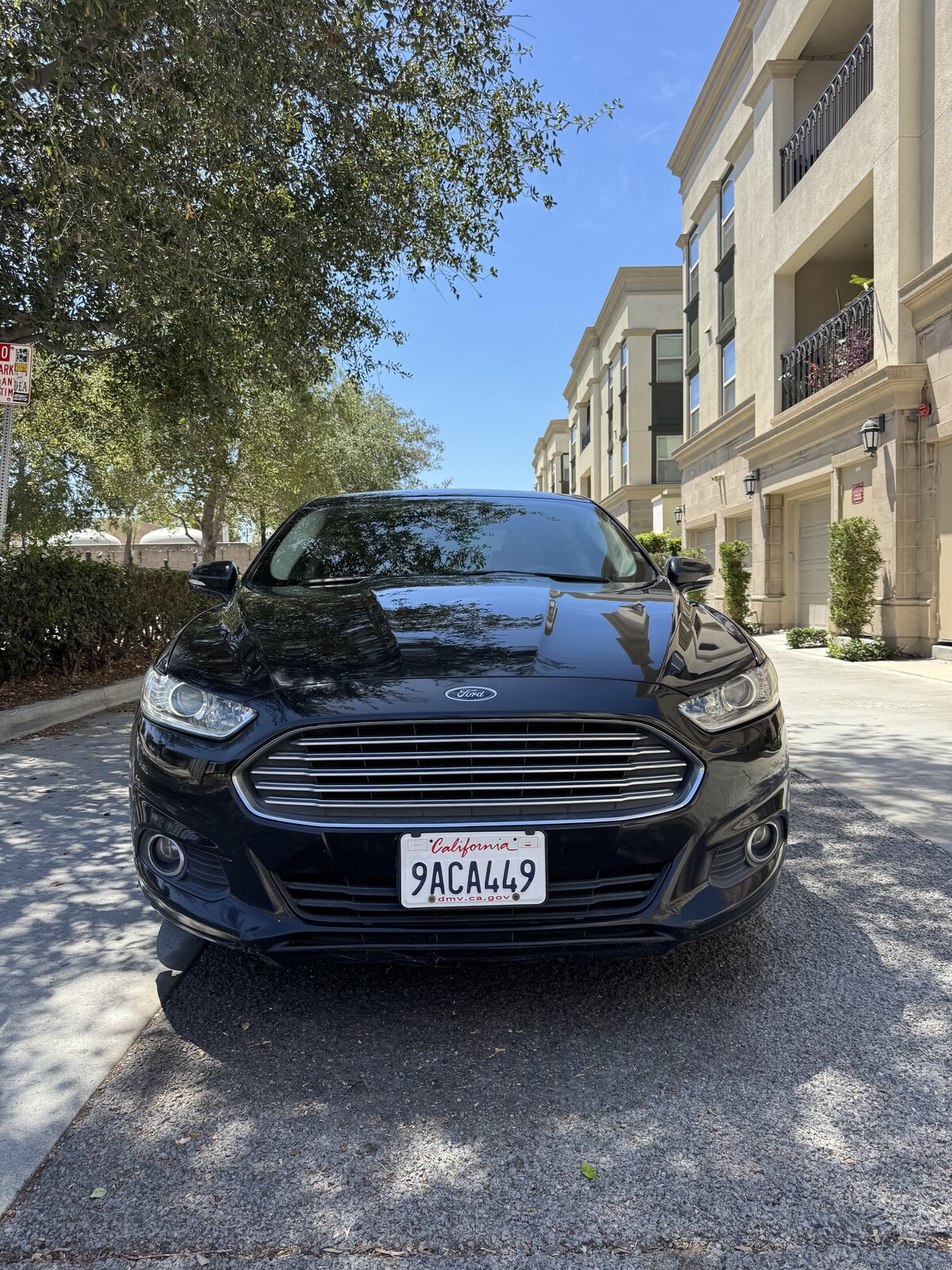 Black 2014 Ford Fusion Hybrid head-on front view