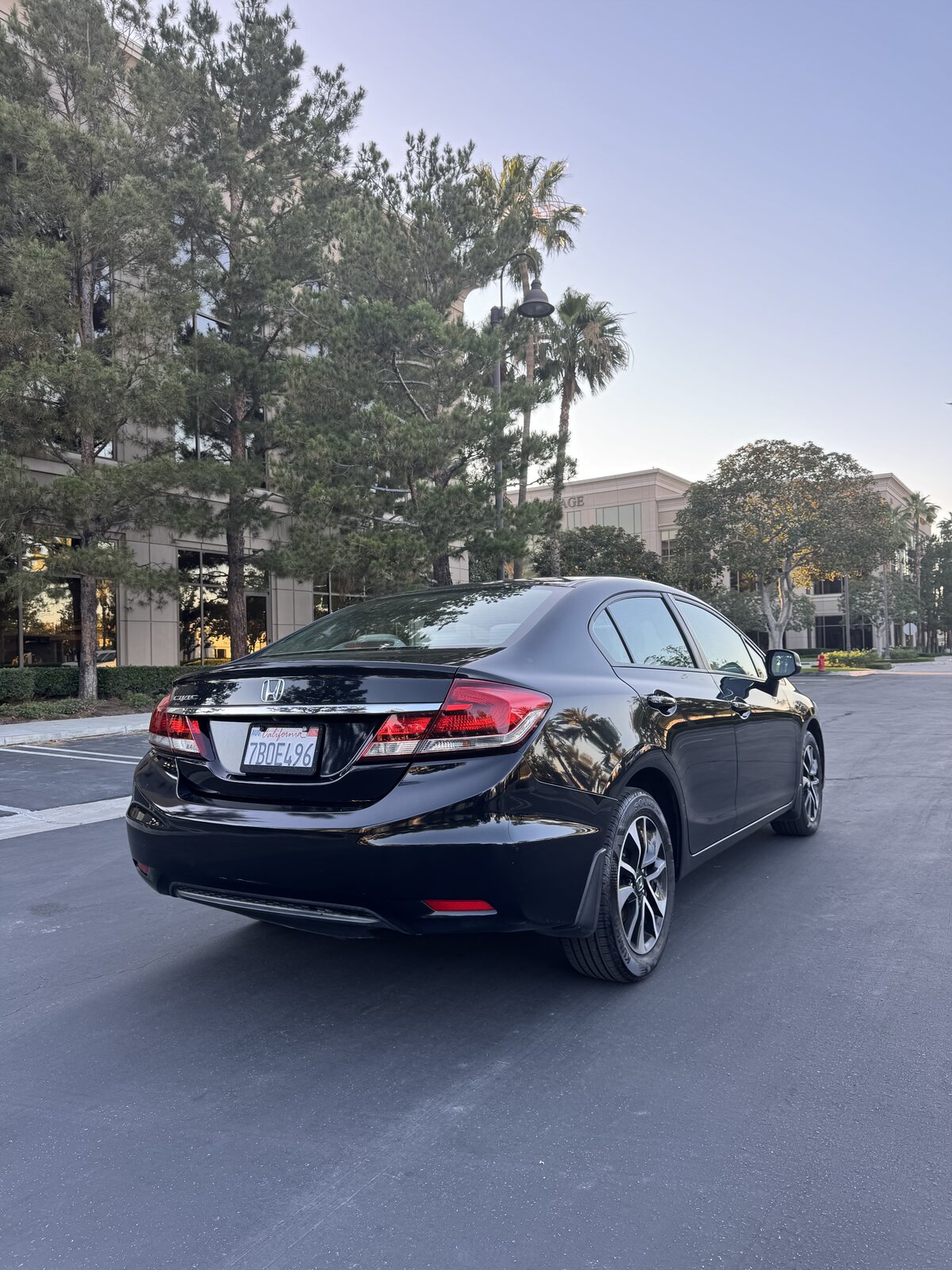 Black 2013 Honda Civic EX rear passenger-side three-quarter view