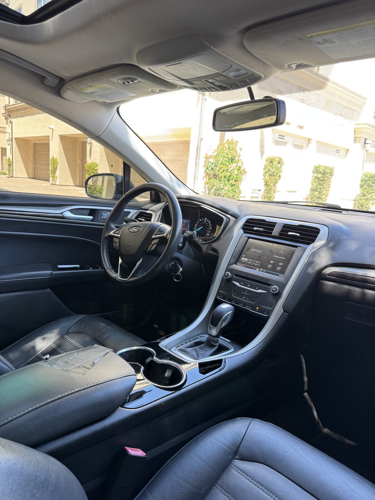 2014 Ford Fusion Hybrid driver seat, steering wheel and SYNC touchscreen