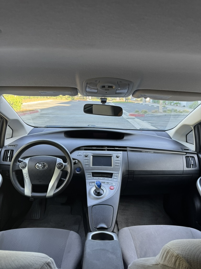 2012 Toyota Prius front cabin and dashboard from rear seat